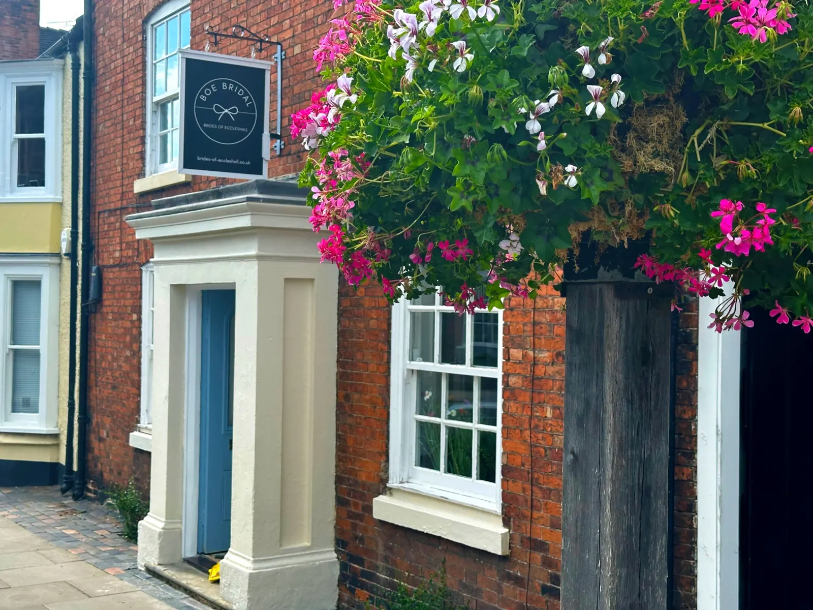 Exterior of BOE Bridal, Brides of Eccleshall boutique with hanging flowers outside the entrance